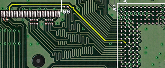 portion of a circuit board with a single long trace highlighted
