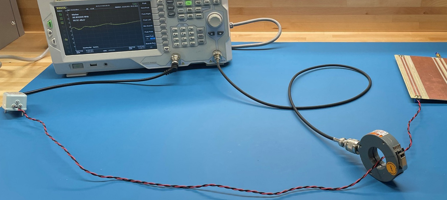 spectrum analyzer with tracking generator connected to a current probe around a twisted pair wire
