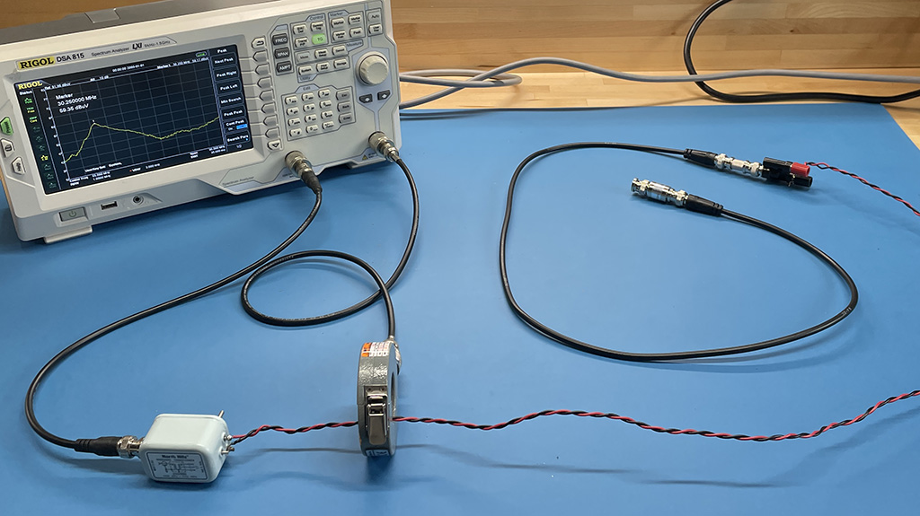 spectrum analyzer with tracking generator driving a balun connected to a twisted wire pair connected to a coaxial cable