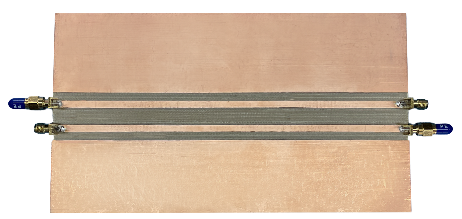 test fixture for CM filter design. Two parallel microstrip traces with SMA connectors on both ends.