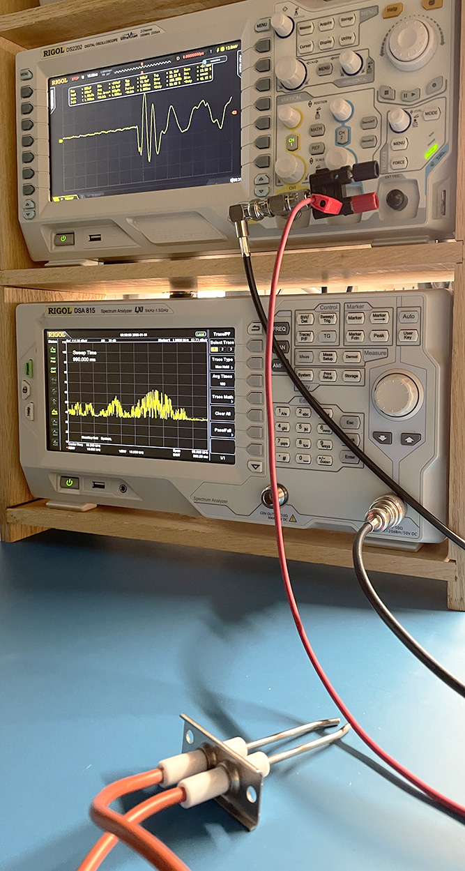 oscilloscope and spectrum analyzer displaying waveforms detected by continuous firing of a spark gap